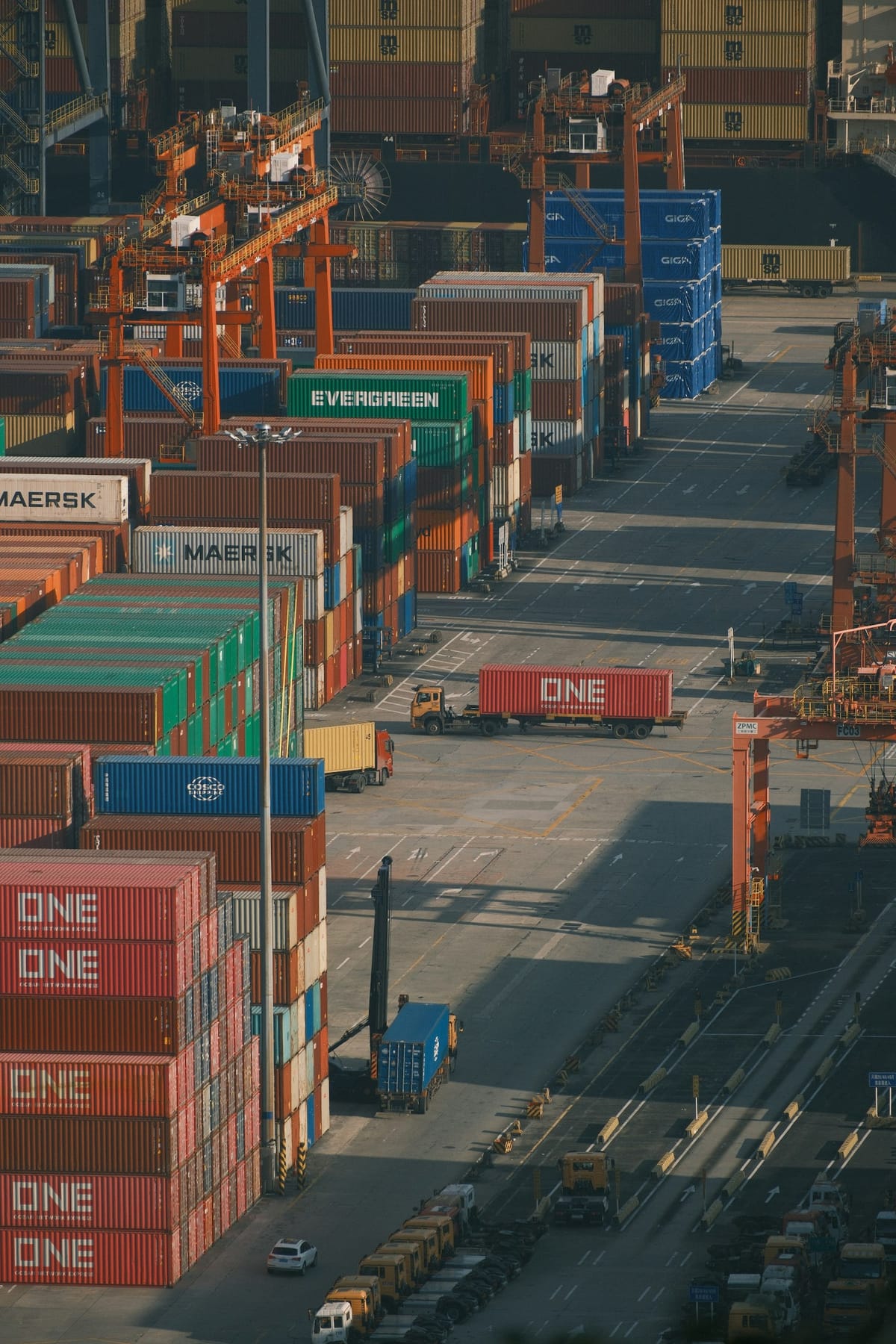 Shipping containers stacked at a busy port